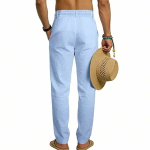 Back view of light blue linen trousers with elastic waist for men's casual wear