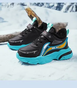 Detail view of black and blue waterproof boys' sneakers with warm fur lining and soft sole