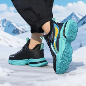 Durable waterproof leather boys running shoes with warm lining on snowy outdoor background