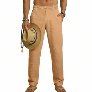 Detailed view of men's beige linen casual pants with drawstring waist for beach vacation