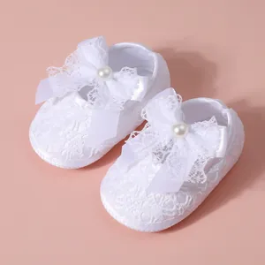 Elegant white lace baby girl shoes with soft soles and decorative pearl bowknot detail