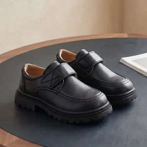 Boys black leather school shoes with hook-and-loop straps in a classic British style