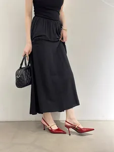 Elegant red pointed-toe slingback high heels featuring a stylish gold metal buckle strap