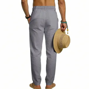 Detailed back view of men's loose linen straight-leg pants for casual vacation style