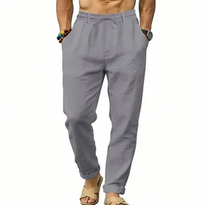 A detailed view showing grey men's linen casual trousers with an elastic drawstring waist
