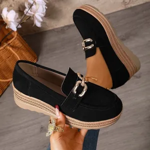 Elegant black suede platform loafers featuring a chic silver metal buckle and woven sole details
