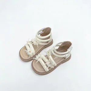 Elegant beige girls' Roman sandals with delicate 3D floral decorations for summer beach