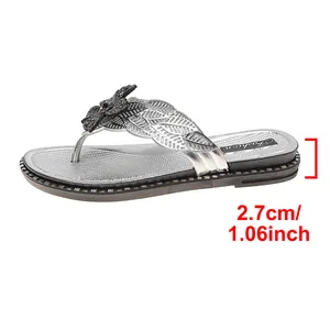 Close-up detail of silver women's thong sandal showing the 2.7cm flat heel height measurement
