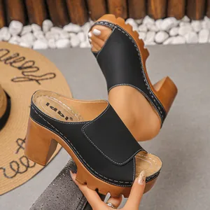 Close-up view of a chunky heel platform sandal with peep toe and contrast stitching