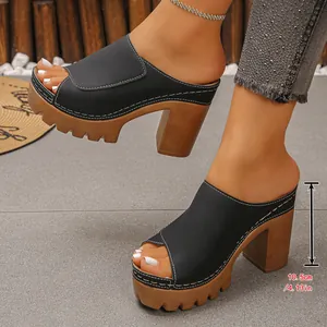 Detailed view of women's black peep-toe platform sandals with 10.5cm chunky heel