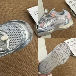 Macro detail of girls' silver mesh sneaker showing breathable fabric and soft grip outsole