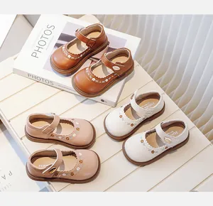Detailed view of toddler girls' Mary Jane shoes with floral embroidery in three colors