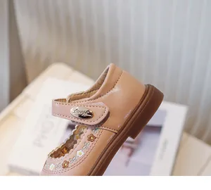 Close-up view of pink toddler girl princess shoes featuring delicate floral embroidery details
