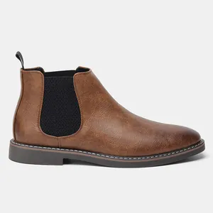 Side view of classic brown burnished men's Chelsea ankle boots with elastic side panels.