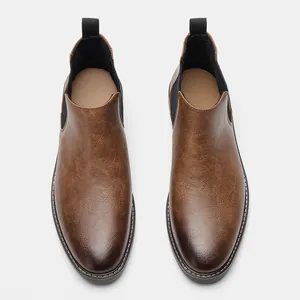 Top view of men's distressed brown Chelsea boots with elastic side panels