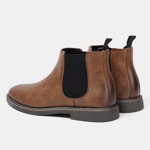 Detailed rear and side view of brown faux leather Chelsea boots with black elastic