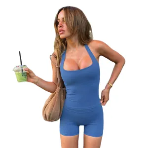 Blue halter neck sports tank top and matching tight yoga shorts shown on model.