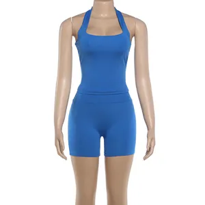 Vibrant blue two-piece athletic set featuring a halter-neck top and fitted gym shorts.