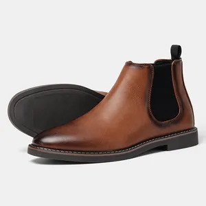 Detail view of men's brown burnished leather Chelsea boots showing side profile and sole.