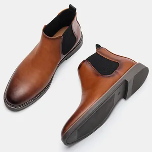 Detailed view of professional burnished brown men's Chelsea boots with elastic panels