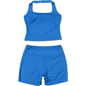 Close-up detail of blue halter neck crop top and matching tight shorts sportswear set