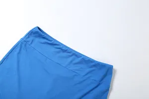 Detailed macro view showing waistband stitching and blue fabric texture of sports shorts