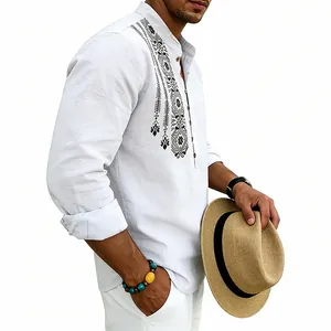 Detail view of men's breathable white linen shirt featuring ethnic tribal print designs