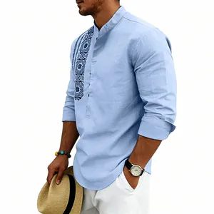 Detail view of light blue linen shirt featuring ethnic embroidery and stand-up collar