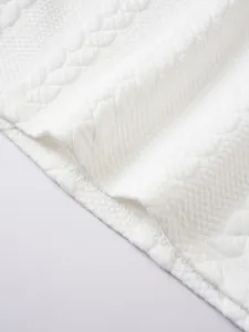 Macro view of white men's polo shirt showing premium jacquard texture and stitching