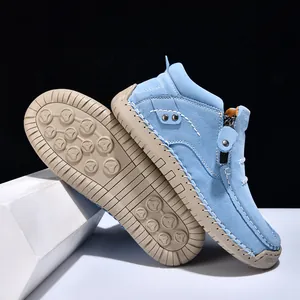 Detail view of light blue hand-stitched high-top casual shoes with durable rubber sole