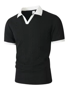 Detail of men's black cable-knit polo shirt with white contrast collar and v-neck
