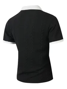 Back view of black short-sleeved polo shirt with white collar and cable knit texture