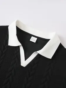 Close-up of contrast white collar and textured black knit polo shirt fabric