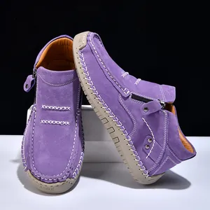 Purple suede high-top loafers with white stitching and side zipper detail