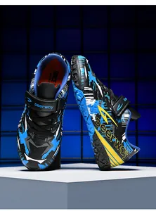 Detailed view of Deerway TF turf soccer shoes with graffiti pattern for kids
