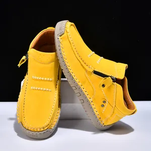 Detailed view of yellow high-top slip-on casual outdoor shoes with stitching