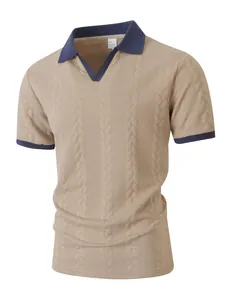 Close-up detail of a men's beige jacquard polo shirt with navy blue contrast collar