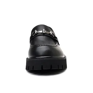 Front view detail of black chunky men's loafer with silver metal horsebit