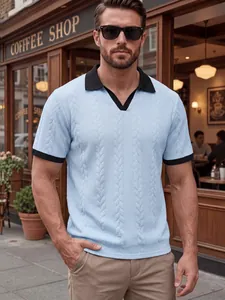 Detail shot of men's light blue cable knit polo shirt with contrast black collar and cuffs
