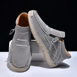 Grey suede high-top slip-on shoes with zipper and hand-stitched details