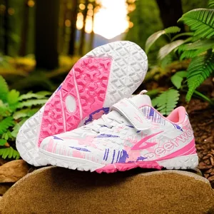 Deerway TF soccer shoes for kids and adults with stylish pink camouflage pattern on turf