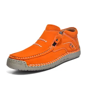 Vibrant orange high-top casual outdoor shoe with white handmade stitching and side zipper.