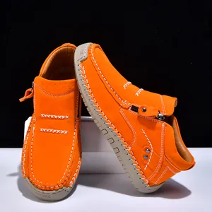 Handmade orange outdoor casual loafers with white stitching and side zipper detail.