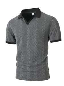 Detailed close-up of men's grey jacquard cable-knit polo shirt with black contrast collar