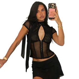 Mirror selfie showing a sexy black sheer mesh short sleeve top with button details