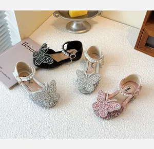 Selection of sparkly girls princess shoes with rhinestone butterfly ornaments