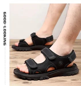 Vista lateral de sandalias deportivas negras para hombre con correas de velcro
