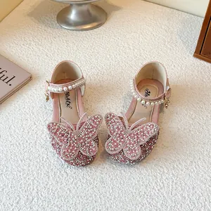 Sparkly pink girls princess shoes with butterfly rhinestone detail and pearl straps