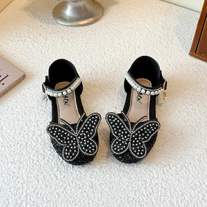 Elegant black girls' princess shoes with rhinestone butterfly and pearl strap details.