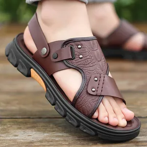 Stylish men's brown crocodile embossed sandals with thick rubber soles and silver metal studs